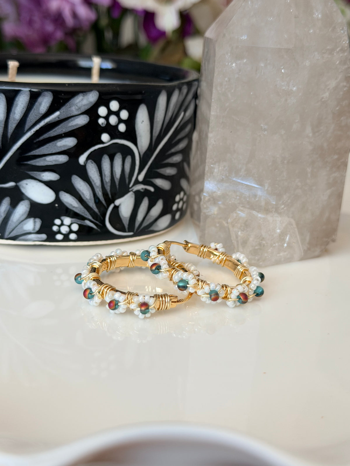 Hoop Earrings in White, Aqua Blue, and Gold.