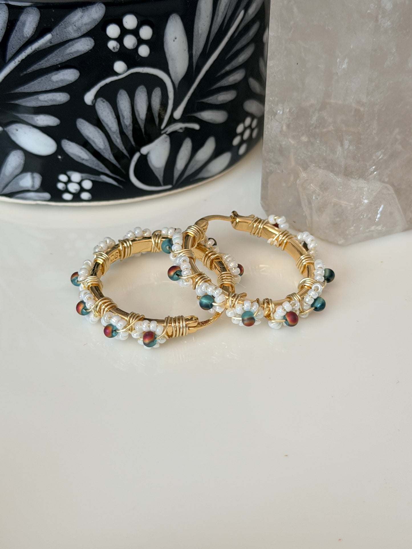 Hoop Earrings in White, Aqua Blue, and Gold.