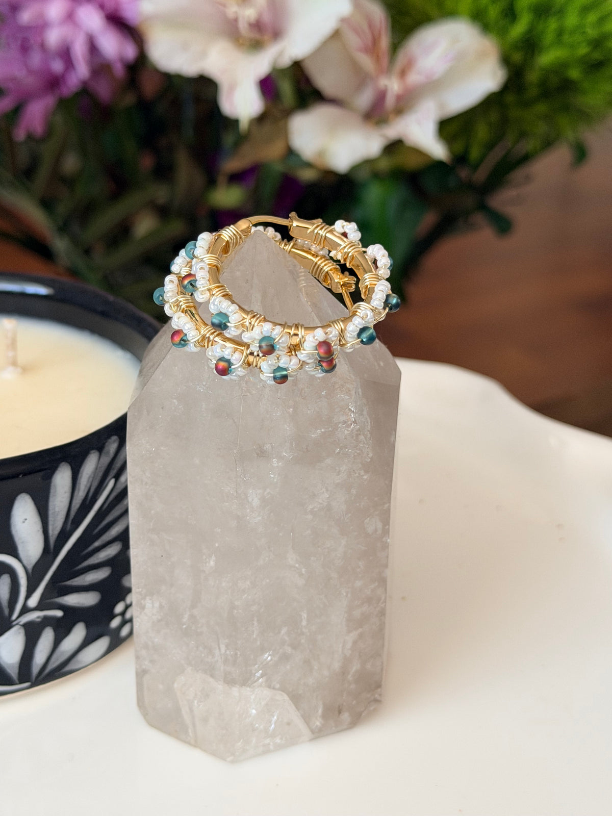Hoop Earrings in White, Aqua Blue, and Gold.