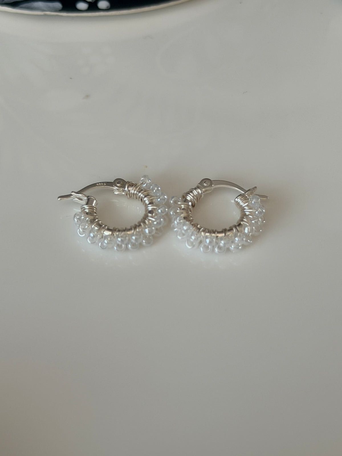 Hoop Earrings (mini) in White and Silver.