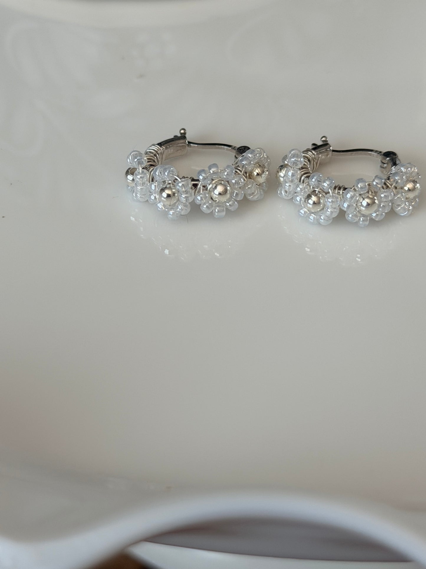 Hoop Earrings in White and Silver.
