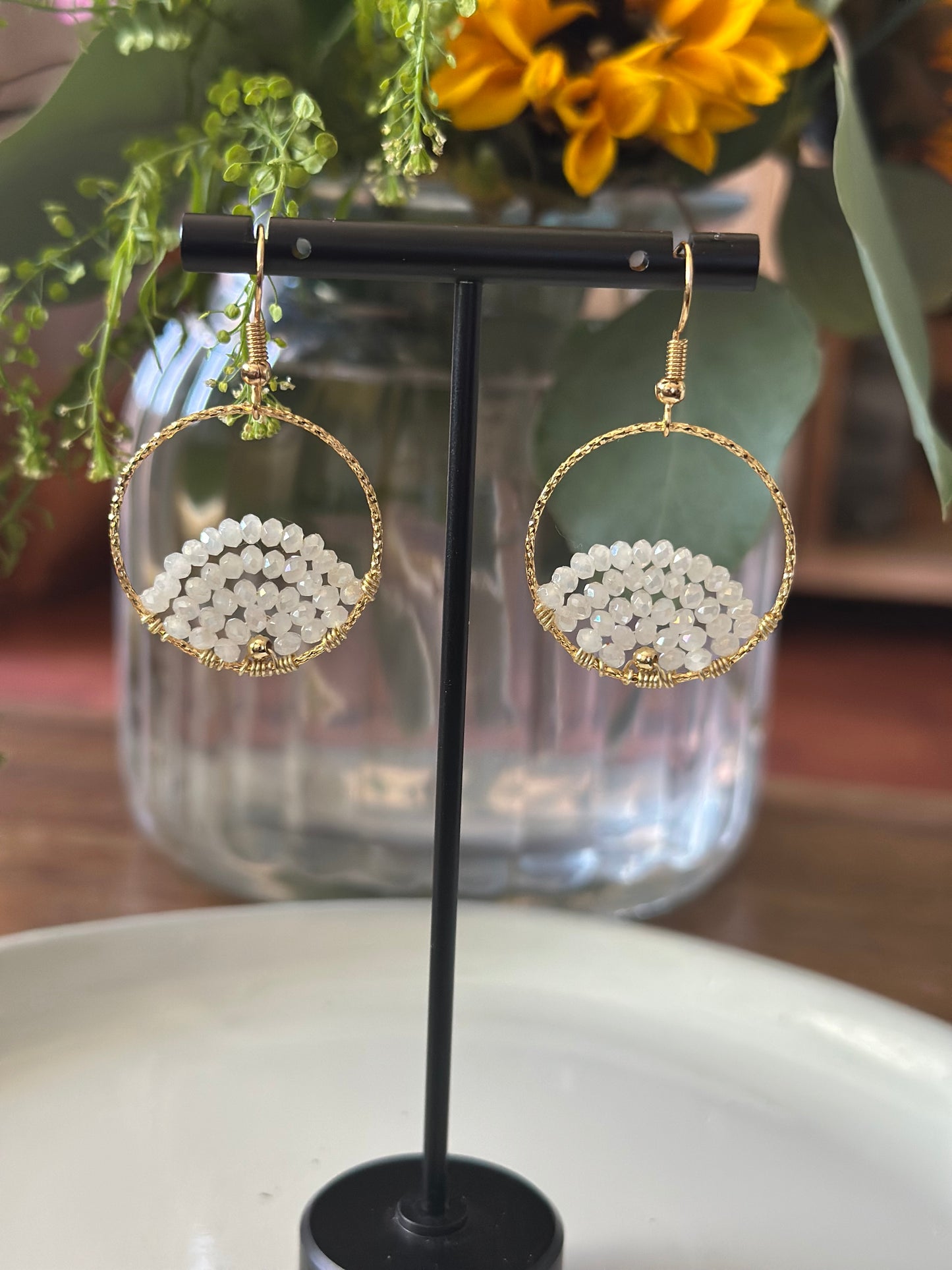 Dangle and Drop Earrings in White and Gold.