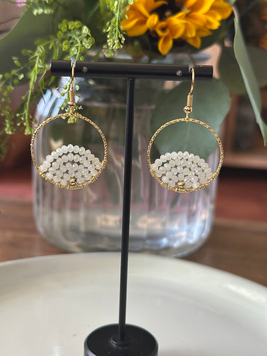 Dangle and Drop Earrings in White and Gold.