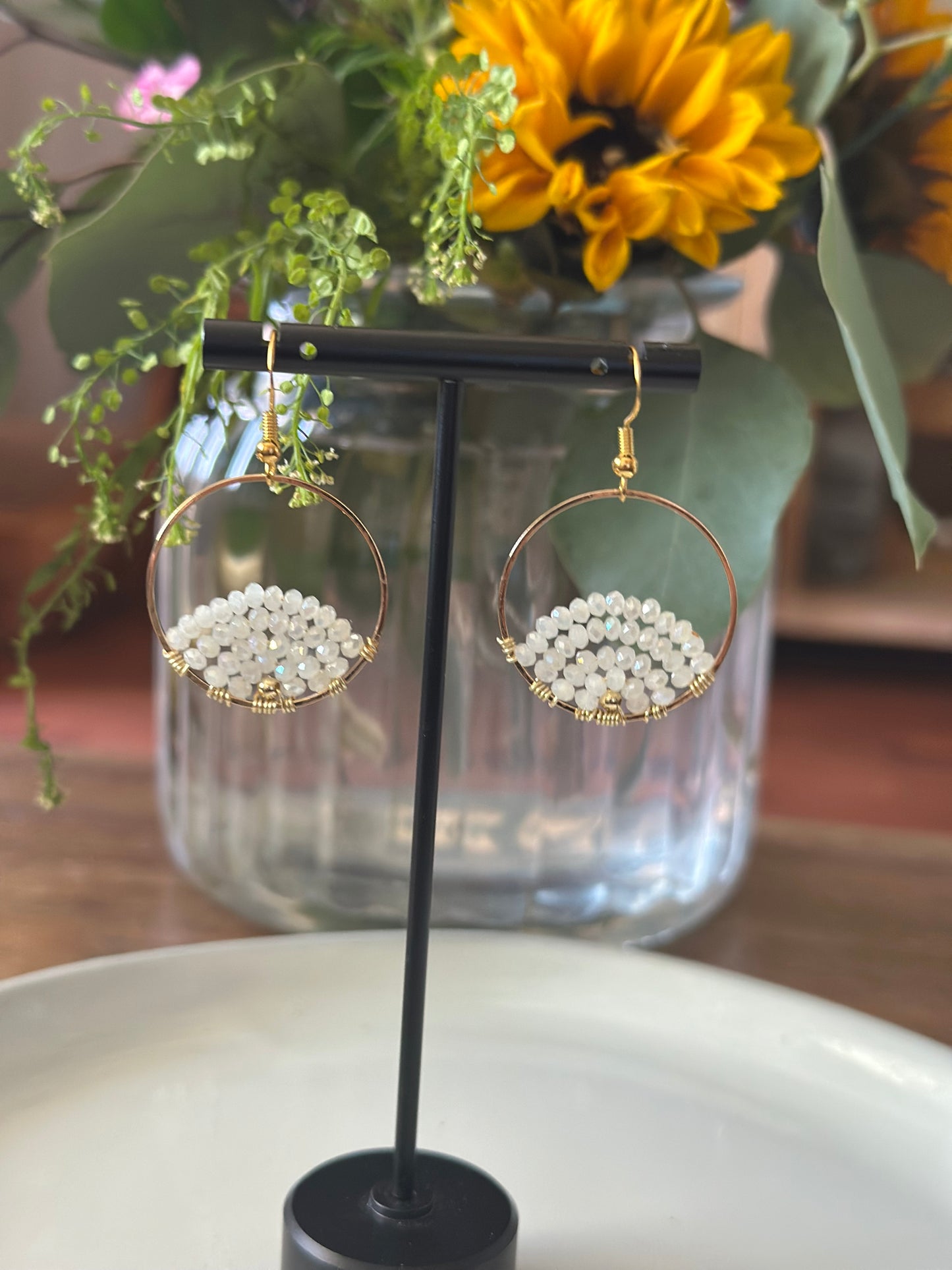 Dangle and Drop Earrings in White and Gold.