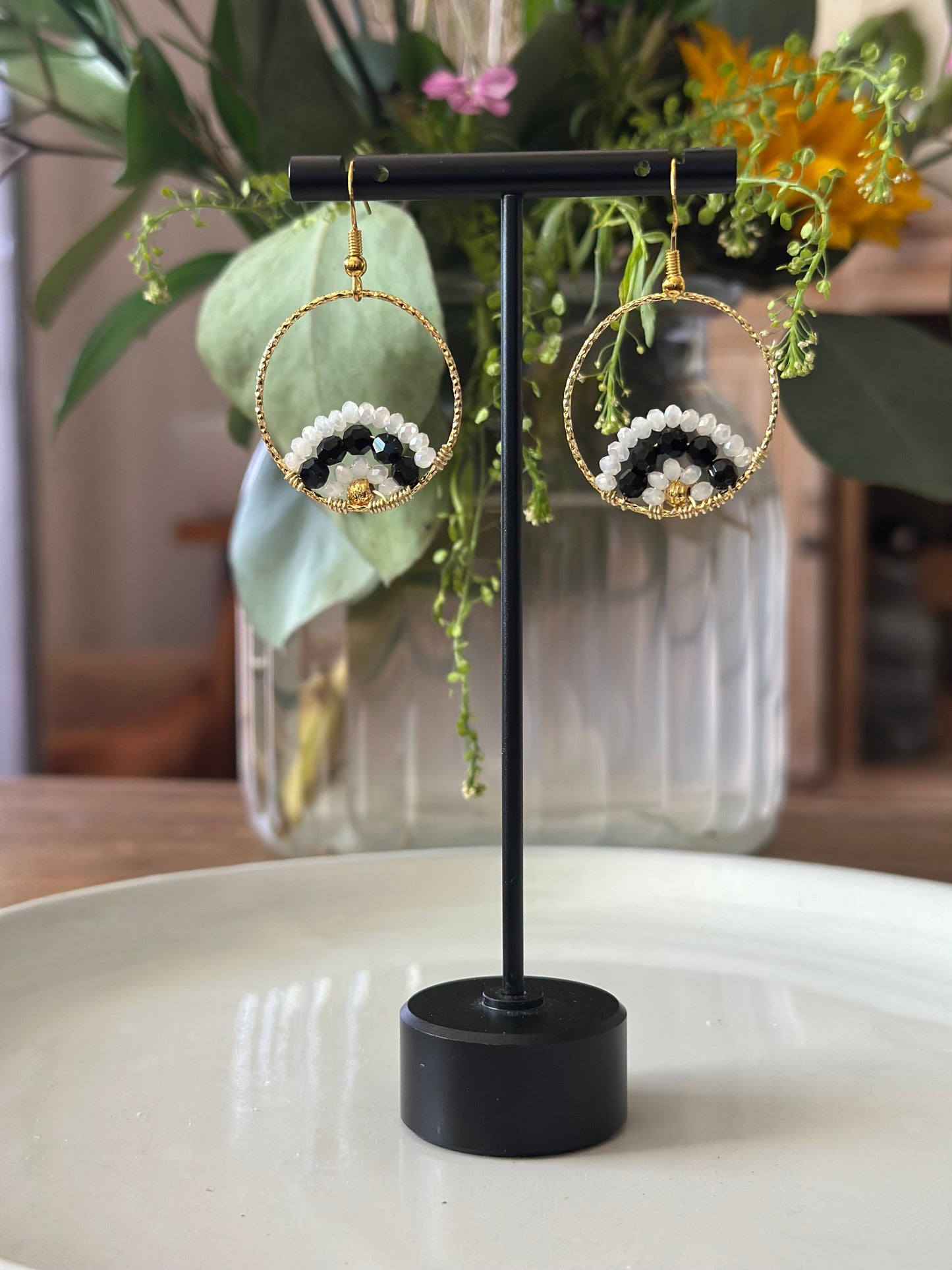 Dangle and Drop Earrings in White and Black, and Gold.