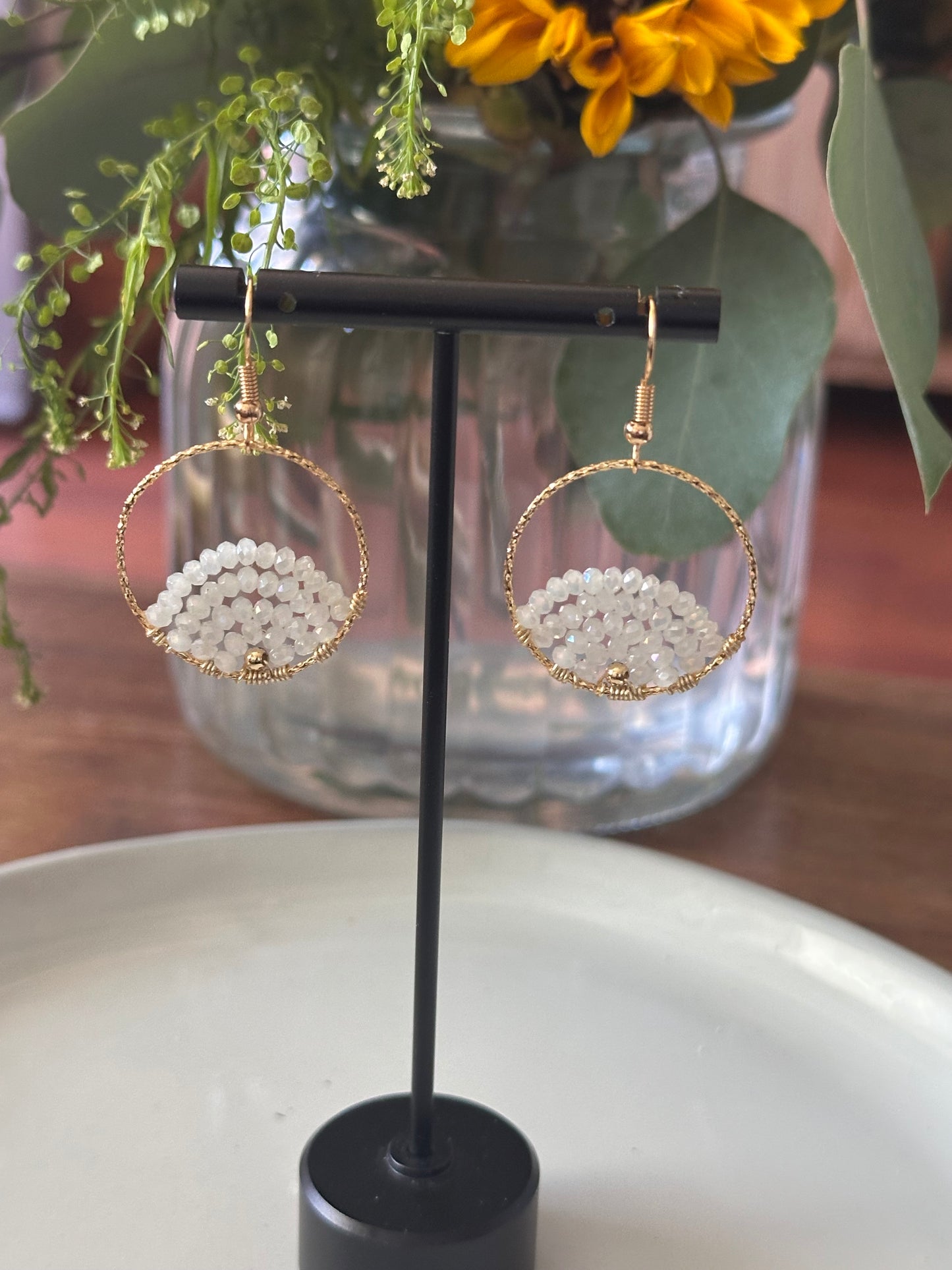 Dangle and Drop Earrings in White and Gold.