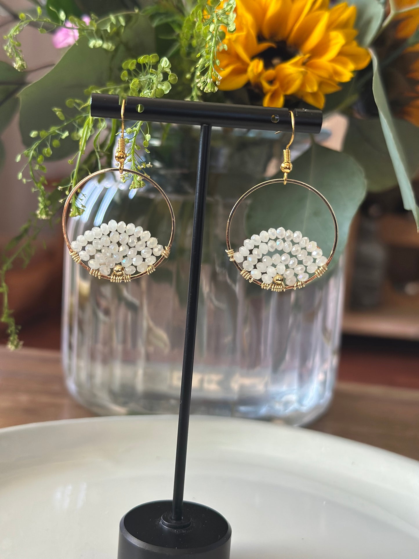 Dangle and Drop Earrings in White and Gold.