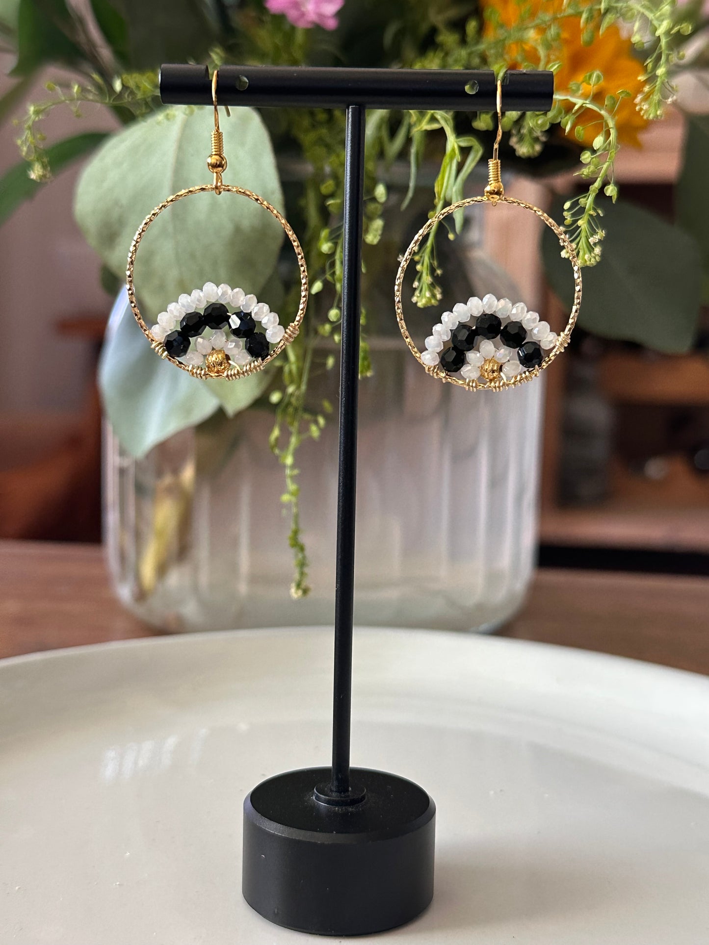 Dangle and Drop Earrings in White and Black, and Gold.